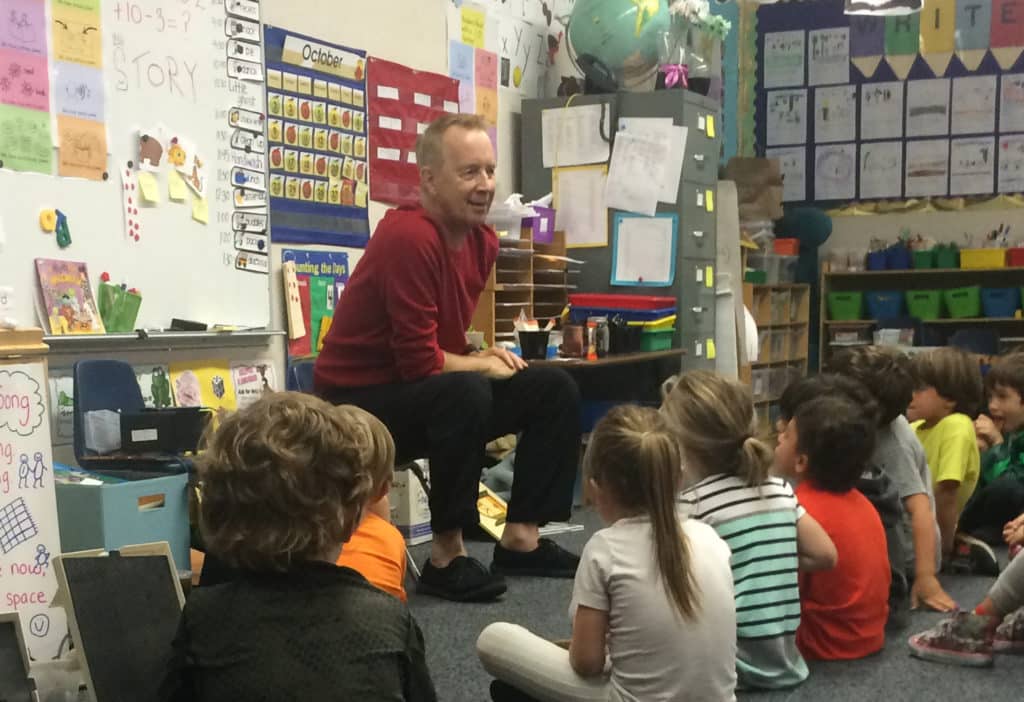 Alan Scofield telling a story to Kindergartners